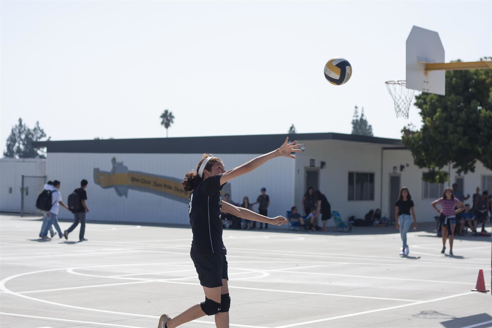 Student plays volleyball