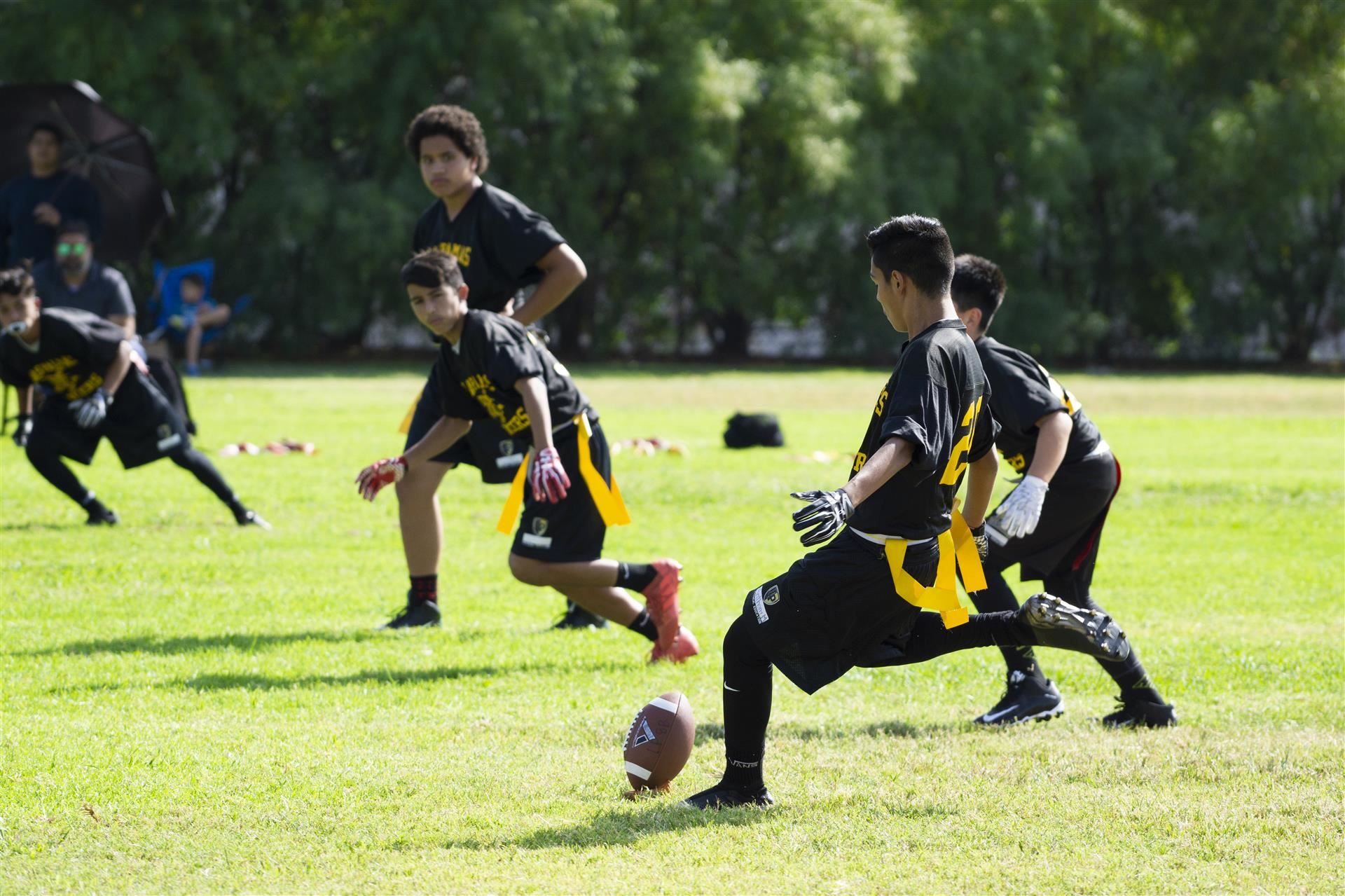 Boy prepares to kick football