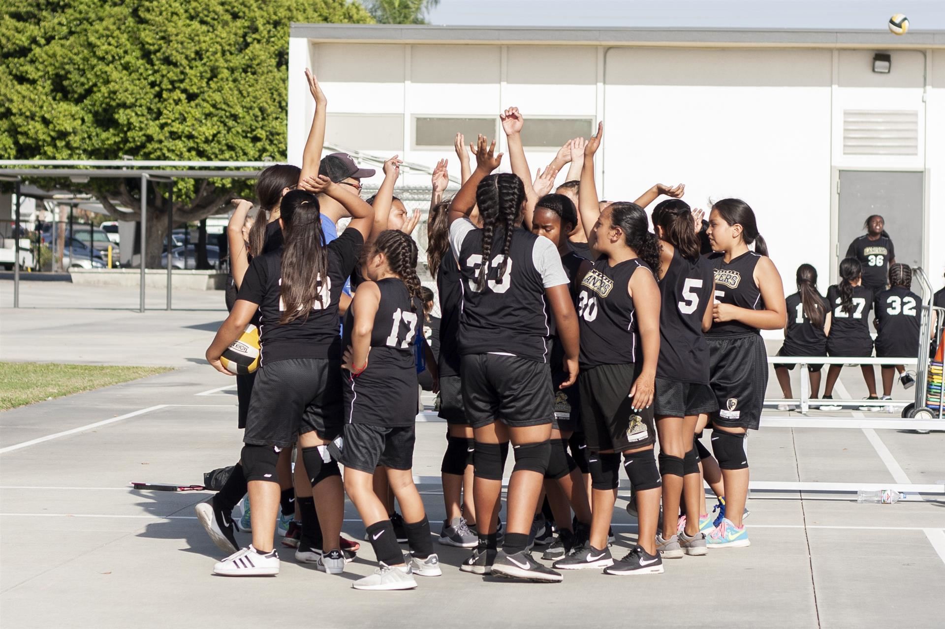 Female players give team high-five