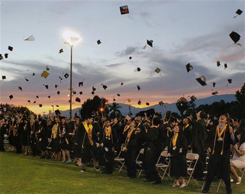 Northview graduates throwing their caps in the air