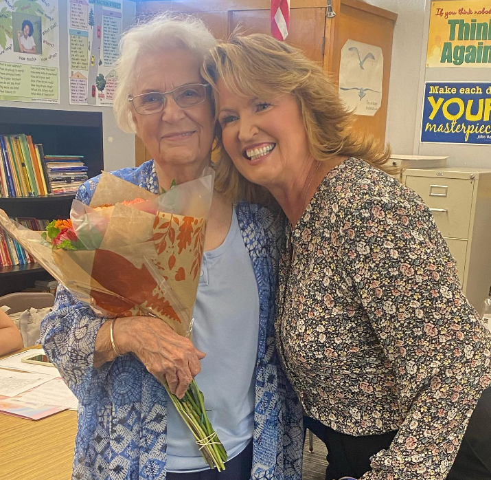  Cornella VerHalen receives a bouquet of flowers from Superintendent Dr. Elizabeth Eminhizer