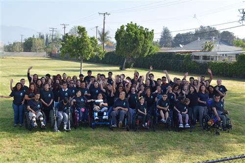 ATP students and staff gather on field